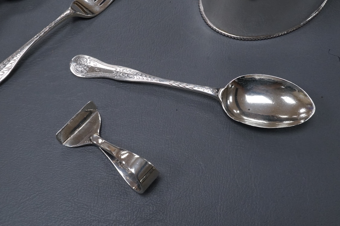 A George V silver mounted hand mirror, a silver spoons and pusher, a silver christening fork and spoon and a silver plated tea caddy.